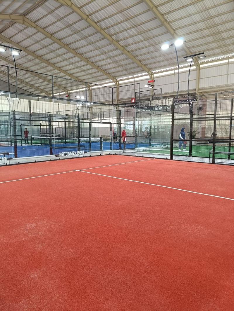 Terracotta padel court indoor di multi-court facility